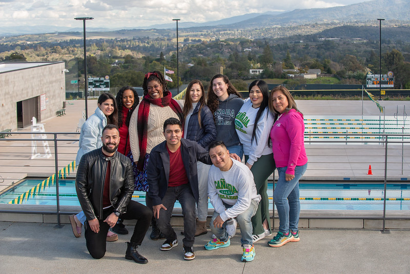 Group of students pose for a photo during a campus photoshoot  